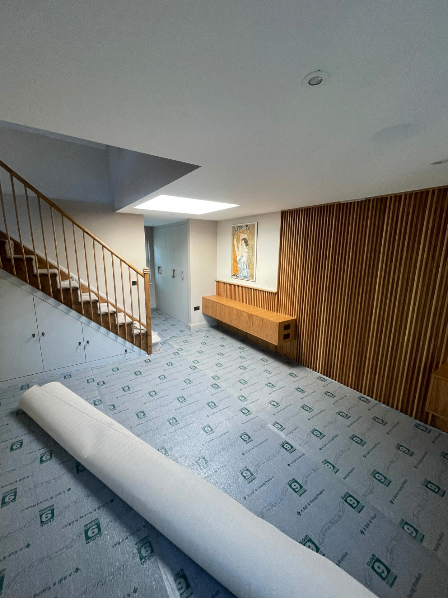 Hallway with underlay being laid